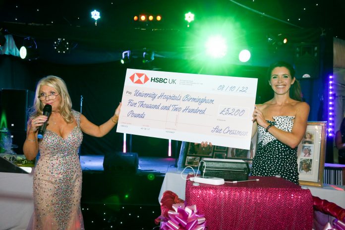 Sue Cressman presents a cheque for one of the localizer probes to Charlotte Schofield, Director of Fundraising at UHB Charity