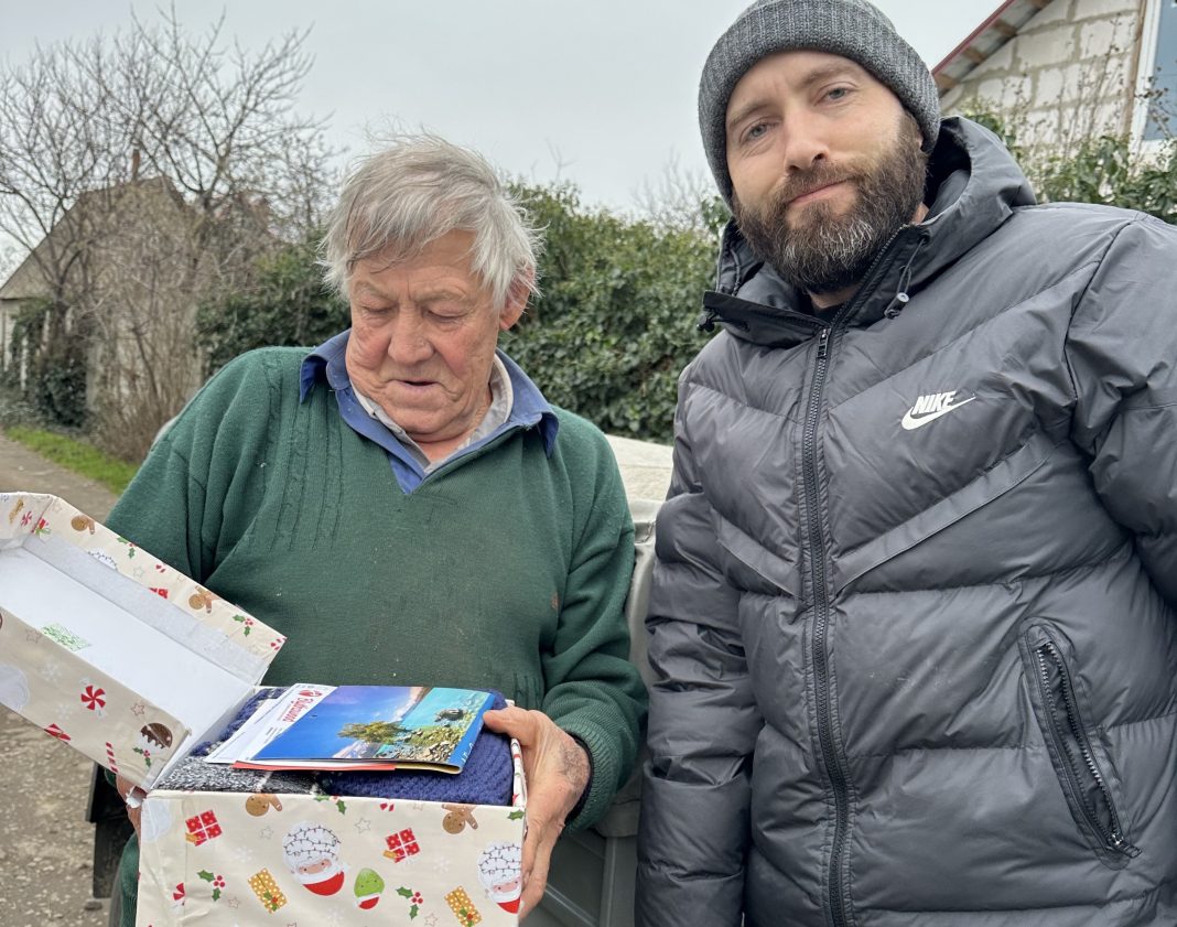 Viktor receives a gift parcel from Pastor Yan Hrosu Feed The Hungry, Ukraine